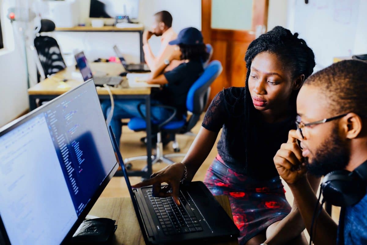 Students looking at their computer together
