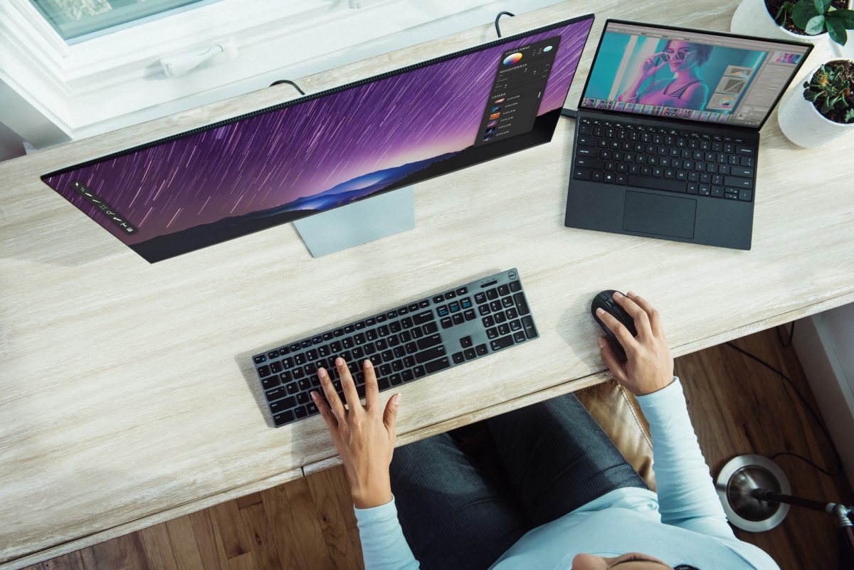 Person using two screens