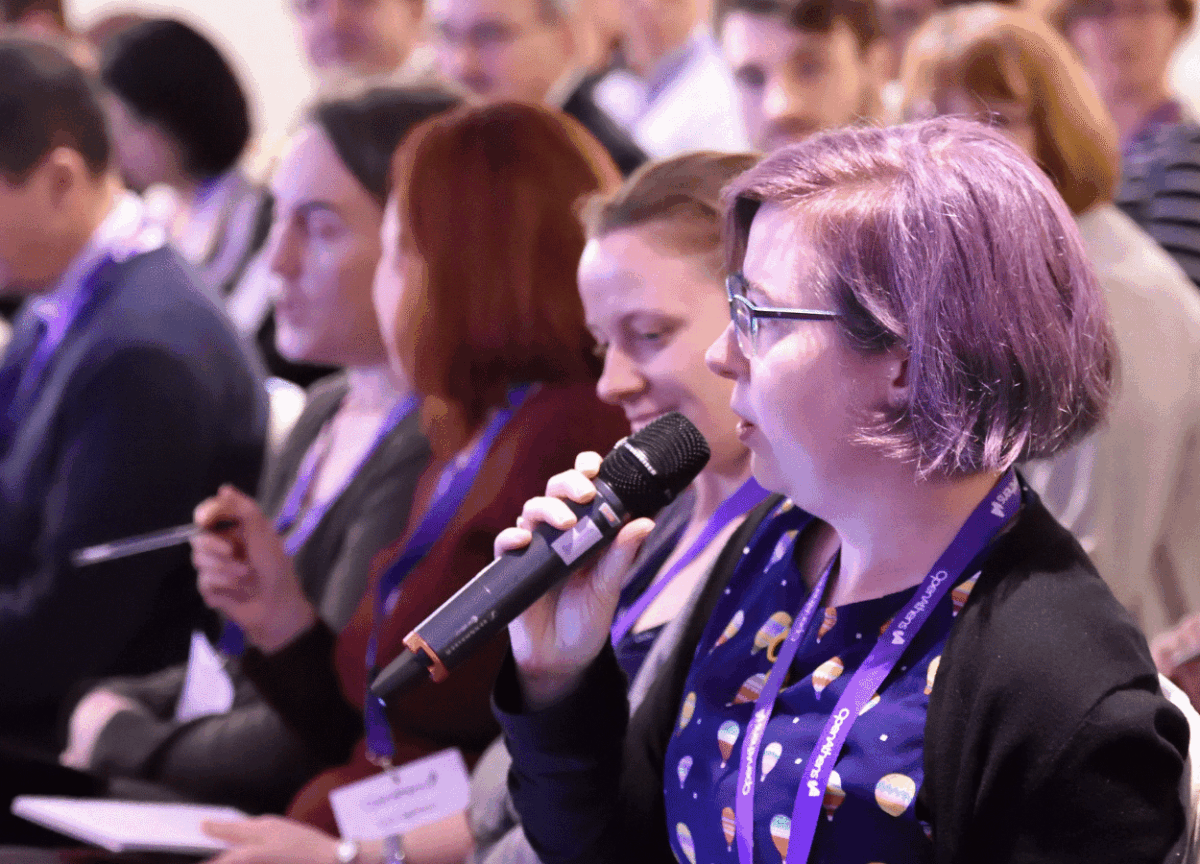 Access Lab 2022. Woman speaking into microphone.