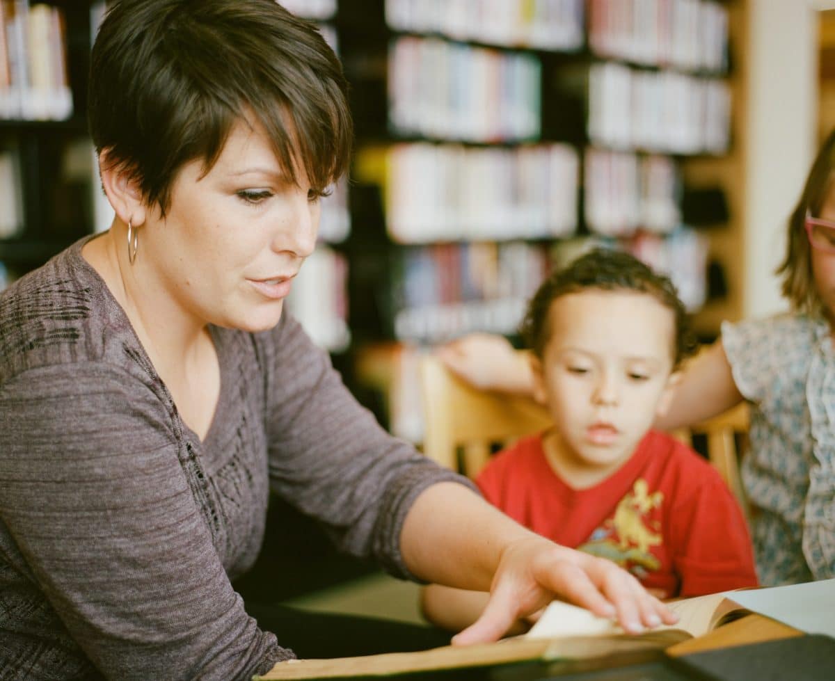 adult teaching child