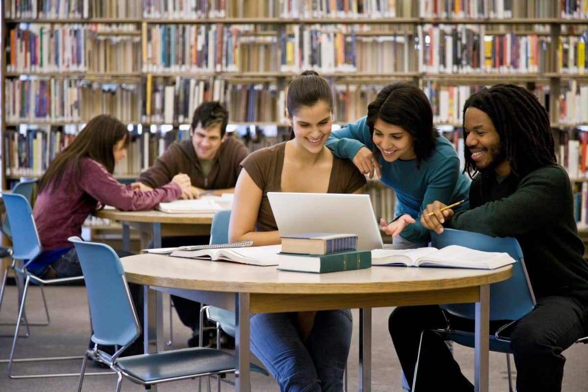 Access Lab 2024 news release. Multi-ethnic college students studying at library