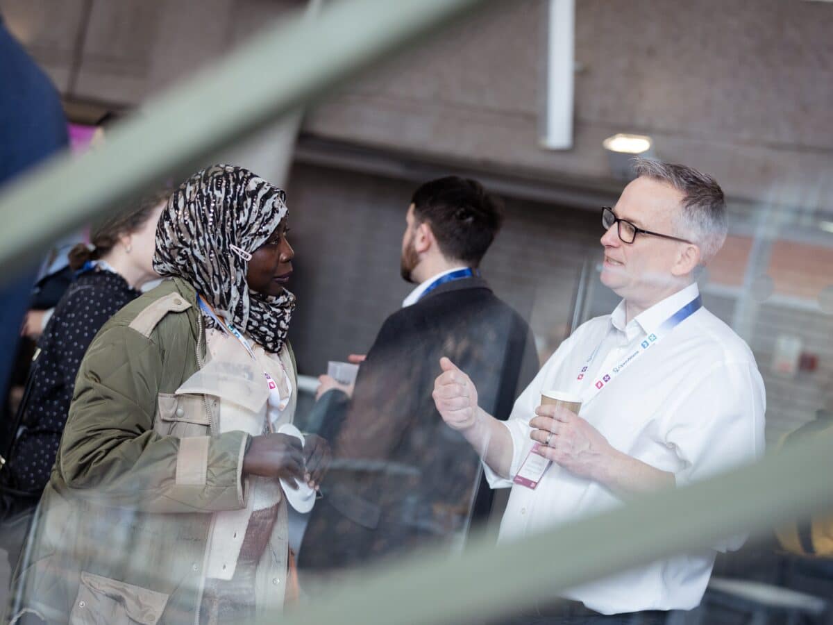 A women and man talking at Access Lab EMEA.